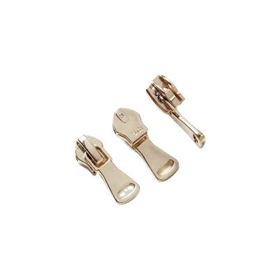 China Other factory hot selling custom plating zinc alloy gold metal zipper sliders as clothes accessories for sale