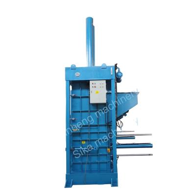 China Garment Four Door Vertical Hydraulic Clothes Packing Machine Baler Press Machine for sale