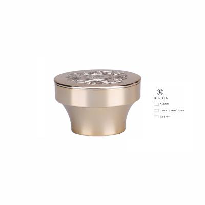 China Non Spill Plastic Bottle Cap Gold Cap With Embossing Pattern for sale