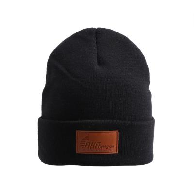 China Top Selling COMMON Clean Logo Black Slouch Leather Label Acrylic Beanie Hat for sale