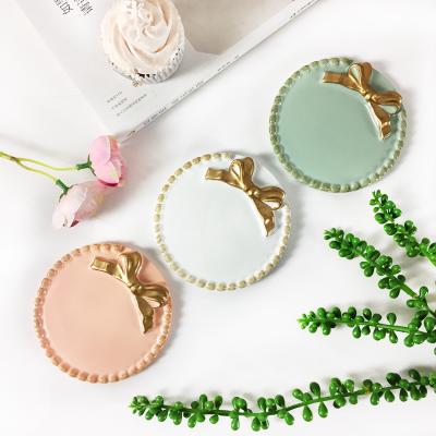 China As creative Japanese and Korean craft resin picture gifts, dessert cake dishes, bow ornaments, jewelry storage trays for sale