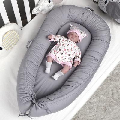 China Newborn Detachable Washable Cotton Nest Portable Folded Baby Crib Nest Baby Sleep Bed with Handle for sale