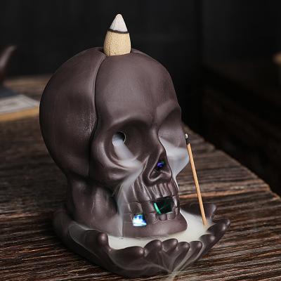 China Creative Skeleton Chinese Incense Decor with LED Light Backflow Incense Holder Running Stick Incense for sale