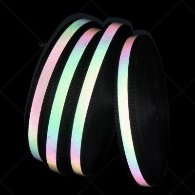 China High Visibility Rainbow Strip Reflective Fabric with Black Ribbon 25mm*100m per Roll for sale