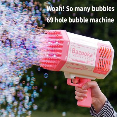 China Automatic Rocket Bubble Guns Toys Free Battery Outdoor Glowing Bubble Kids Toys Gun for sale