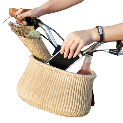 China Sustainable Customizable Wind Rattan Basket Bicycle Front Hanging Single Bicycle Storage Basket for sale