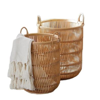 China Factory direct sales viable can be customized different sizes round hollow rattan Christmas gift basket with handle Easter basket for sale