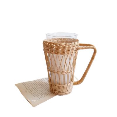 China INS Sustainable Style Rattan Handmade Coffee Mug Wrap Woven Rattan Wicker Handle Glass Mug With Rattan Cup Holder for sale