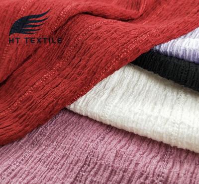 China Hot Sale Memory Plain Dyed Striped Polyester Spandex Jacquard Knit Crepe Fabric For Spring Clothing for sale