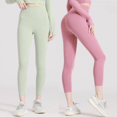 China Antibacterial Drop Shipping 2021 New Hot High Waist Stretch Belly Fishing Hip Pants Women's Naked Sports Fitness Hip Tight Pants for sale