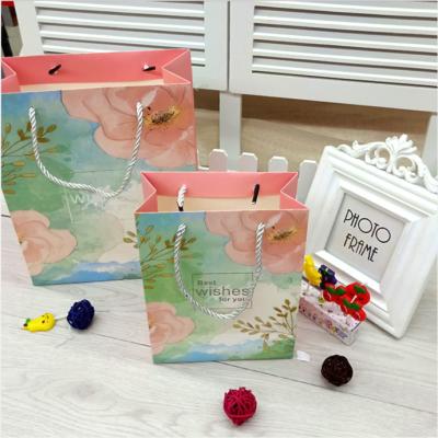 China Recyclable Paper Bag Children's Christmas Tote Bag Gift Clothing Bag for sale