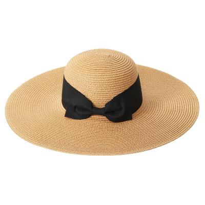 China 2022 New Supplier Eco-friendly Wholesale Flat Wide Brim Outdoor Sun Soft Straw Hat With Bow for sale