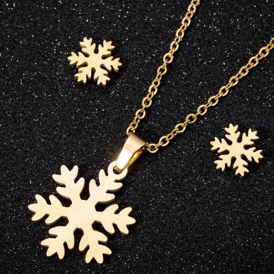 China Casual/Sporty Women Fashion Stainless Steel Gold Plated Necklace Christmas Snowflake Pendant Necklaces Hollow Snowflake Earring Jewelry Set for sale