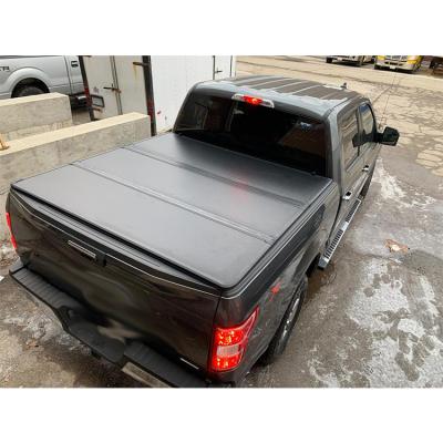 China Affordable Top Hard Triple Tonneau Cover Electric Folding Tonneau Cover Flat Type For Ford F150 for sale