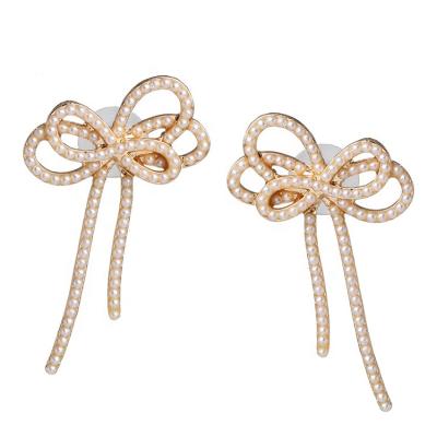 China New Fashion Style Trendy Bowknot and Rhinestone Butterfly Earrings White Seed Pearl Bowknot Stud Earrings for sale