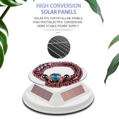 China Advertising 12cm Solar and Battery Display Stand 360 Degree Rotating Display Jewelry Doll Accessories Display Rack for sale