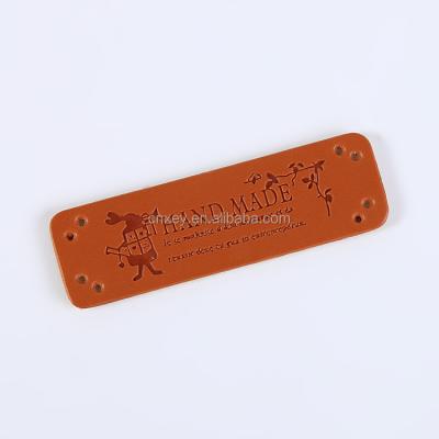 China Sustainable Apparel PU Labels Handmade Tags Hand Made Leather Labels For Garment for sale