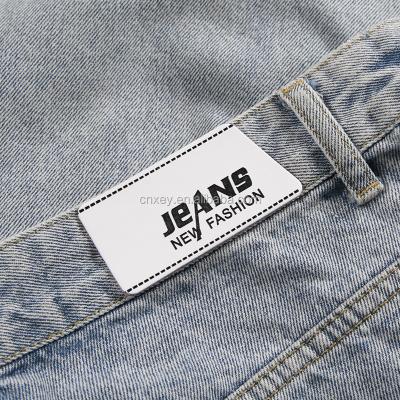 China Sustainable Custom PU Clothing Label White Leather Label For Jeans for sale