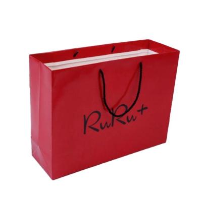 China Recyclable Clothing Store Red Color Laminated Customized Paper Bags for sale