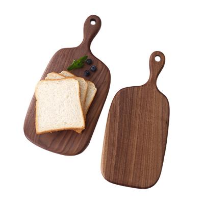 China Disposable Small Bread Vegetable And Fruit Cutting Board Suitable With Handle Black Walnut Cutting Board for sale