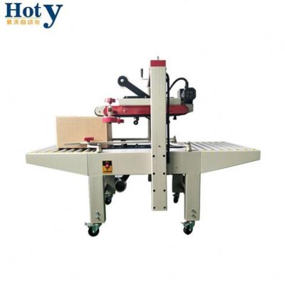 China CLOTHING CE Approved Carton Box Closing Sealer Machine for sale