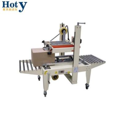 China Nitrogen Gas HOT SALE CLOTHING Pedal Tape Carton Sealing Machine Foot Rinser for sale