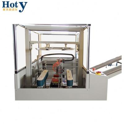 China High Speed ​​CLOTHING Cardboard Carton Taping Side Seal Gasket Machine for sale