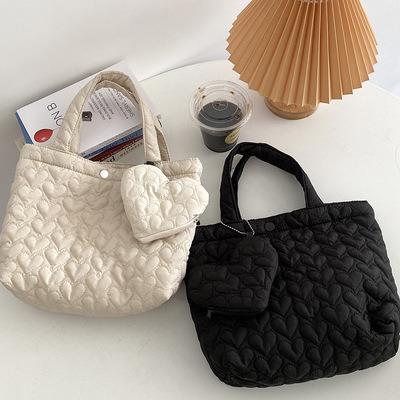 China Fashion Amazon Fashion Stripper Bag Versatile Shopping Bag Heart Shaped Quilted Student Carrying Cloth Small Bag for sale