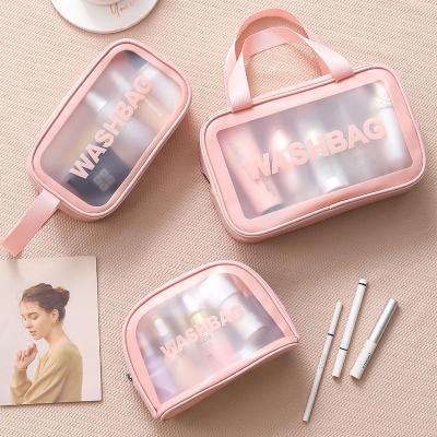 China Custom Logo Travel Transparent Vinyl Waterproof Beach Fashion PVC Toiletry Wash Bag Custom TPU Zipper Cosmetic Bag With Handle for sale