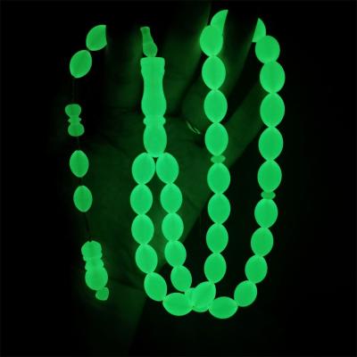 China Religious glow in the dark green luminous Islamic resin 10*14mm oval shape 33 prayer beads misbaha tesbih muslims rosary tasbih for sale