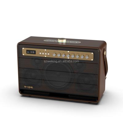 China Portable Wireless Phone Function W-KING Guitar Woofer Bluetooth Speaker with 2pcs Wireless Microphones for sale