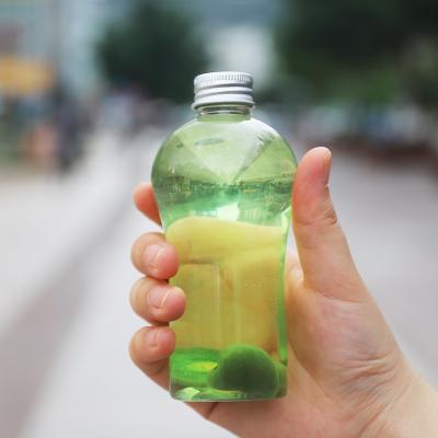 China Mini Wine 200ml Jar Pet Bottle Transparent Plastic Food Bottle Material Recyclable Juice Cup Honey Bottle With Lid for sale