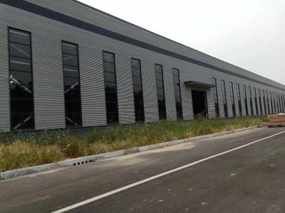 중국 Robust Prefab Steel Warehouse With Rolling Door 판매용