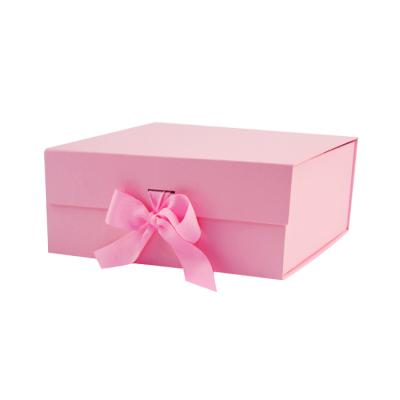 China Recycled Materials Cardboard Box Ribbon Closures Luxury Flat Packing Folding Paper Pink Book Shaped Folded Packaging Gift Boxes With Magnetic Lid for sale