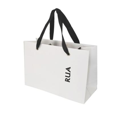 China Recycled Materials Logo Custom Fashion Clothing Paper Shopping Bag Eco - Friendly Simple White Packaging With Handles for sale