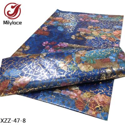 China Viable Shinny African Ankara Wax Design 100% Guinea Brocade Polyester Gold Bazin Fabric For Dress for sale