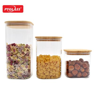 China Sustainable Best Seller Square Shape High Borosilicate Glass Storage Food Jar With Bamboo Lid for sale