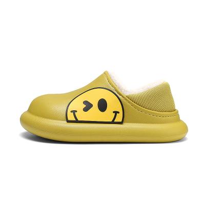 China Waterproof Smile Face Clogs Striped Fluffy Fleece Clogs Girls Boys Sandals Kids Slip On Garden Shoes Waterproof Non Slip Winter Slippers for sale