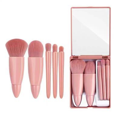 China Angular Blush Pink Color 5pcs Travel Size Makeup Brush Set With Mirror Case for sale