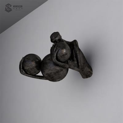 China China Modern 3D Bronze Climbing Man With A Ball Wall Sculpture for sale