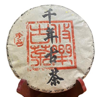 China 2009 Compressed Tea Yunnan Tea High Quality Organic Old Tree Raw Unfermented Pu'er Tea Cake for sale