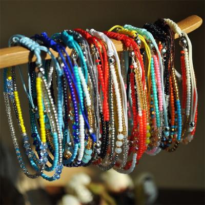 China BOHEMIA colored rice beads bracelet style bracelet tiered bohemian ornament sweet woman braided bracelets and rope bracelets for sale