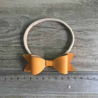 China Latest Popular Cute Baby Cute Bow Hair Bands Leather Bows for sale