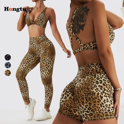 China New Fashion Breathable Women Gym Sets Deep Crop Yoga Twist Top Pleat V Leopard Print Bra Shorts Gaiters Pants 3 Piece Set For Women for sale