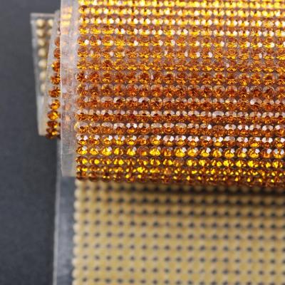 China Eco-Friendly Crystal Rhinestone Flat Back Self Adhesive Sheet Or Hot Fix To Fabric Rhinestone Decor 2mm Mesh Roll For Wedding Bling Trim Ab for sale