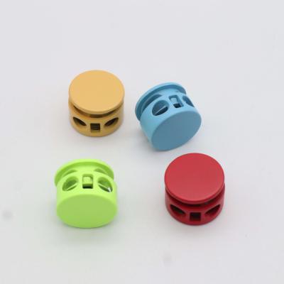 China China Manufacturer Washable Garment Two Holes Custom Logo Around High Screw Rope End Lock Plug Mine Buckle for sale