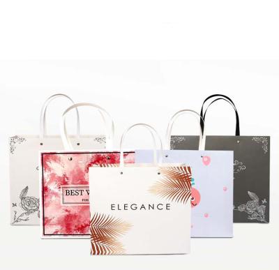 China Recyclable with Ribbon Handles Business Jewelry Luxury Bag Large Carrier Custom Printed Gift Paper Bags for sale