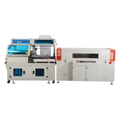 China High Speed ​​Automatic Pure Mineral Food Heat Seal Packing Machine Water Bottle Large Heat Tunnel Shrink Paper Wrapping Machine for sale