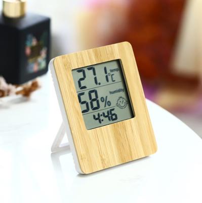 China Indoor Wooden Indoor Digital Humidity Temperature Monitor Bamboo Thermometer with Hygrometer and Alarm Clock for sale