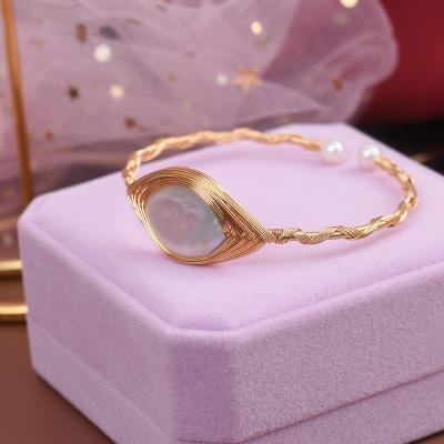 China Delicate Luster Natural Seawater Pearl Bangle Gold Frame Bracelet Women Shape Charm Bracelet Jewelry for sale